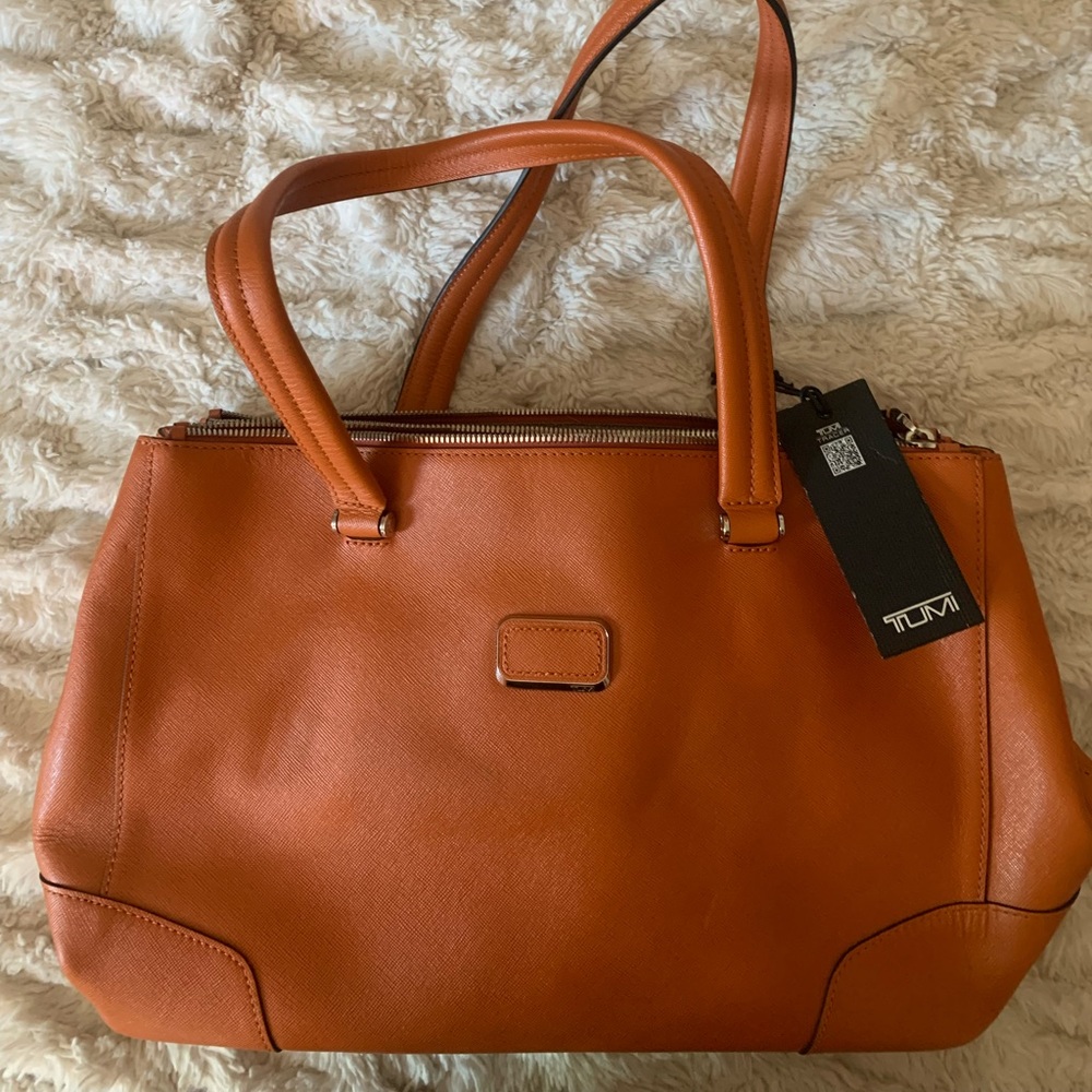 Orange TUMI purse